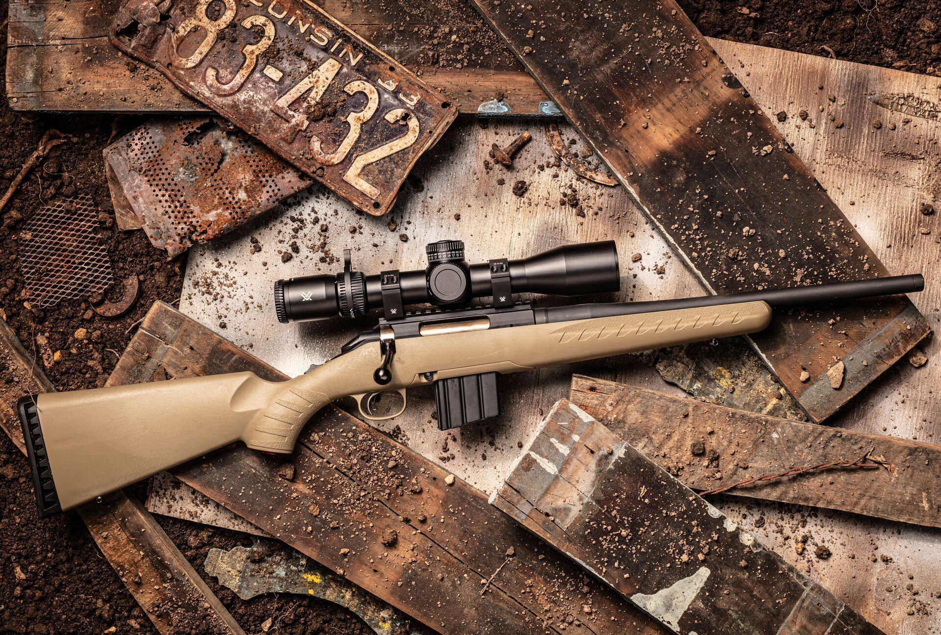 A bolt action rifle on the ground, lever action v bolt action rifles concept.