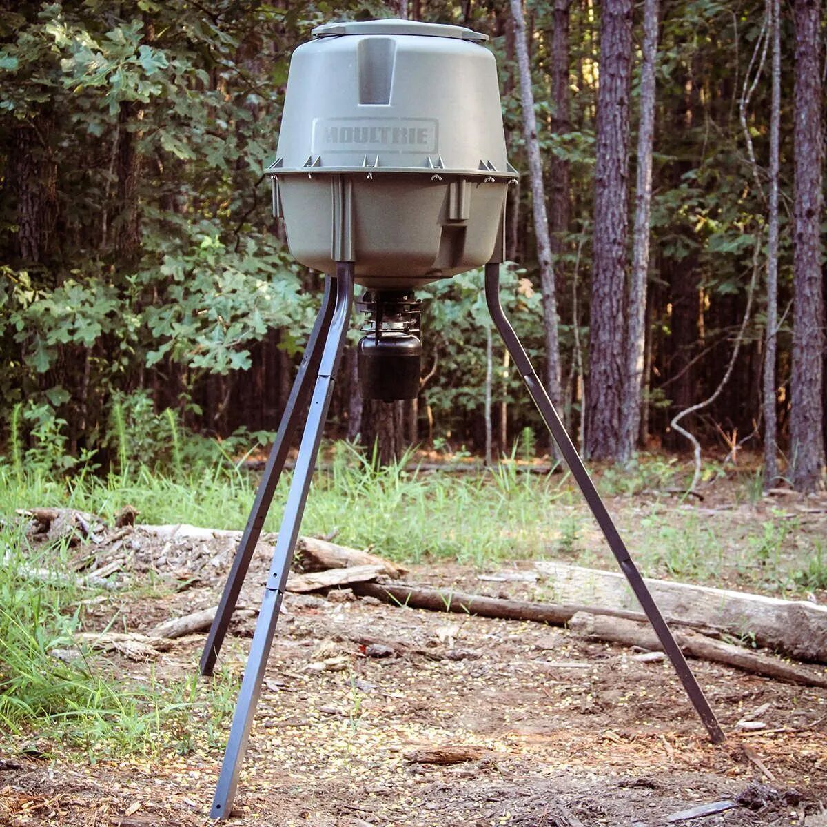 A deer feeder in the trees, best deer feeders concept.