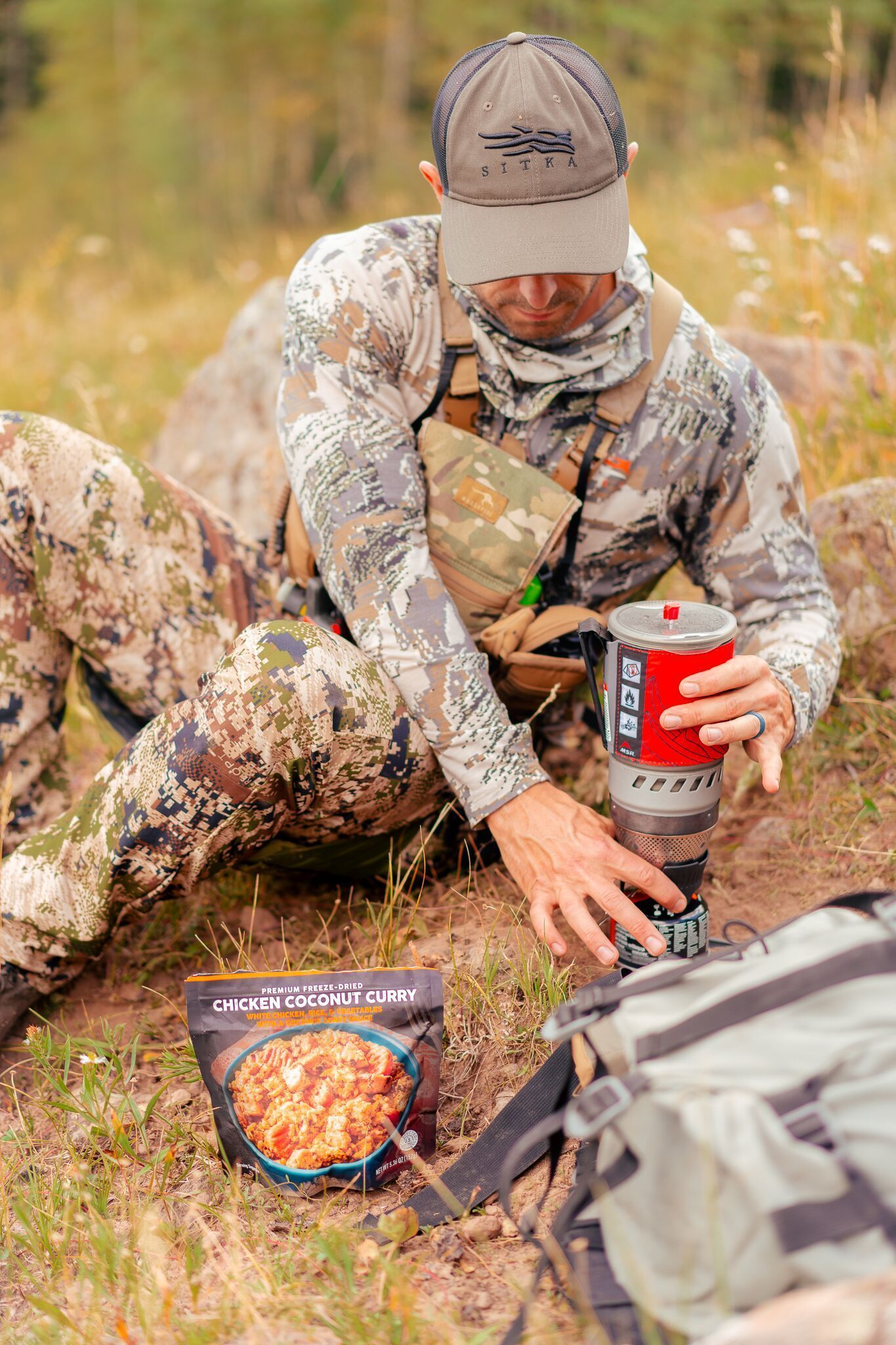 FGBLOG hunter with food at camp.jpeg