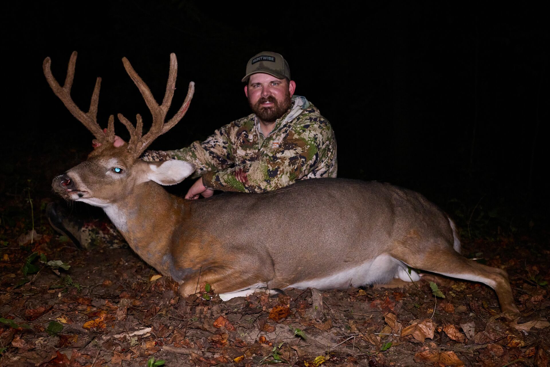 Hunter Quinn Badder with deer after hunt, how to plan a deer hunt with HuntWise concept.