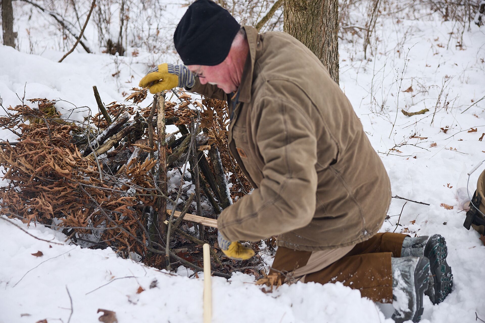 Hunter setting humane animal traps.