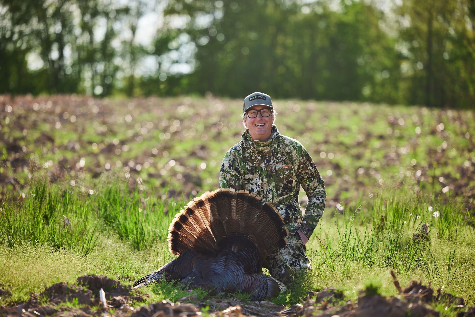 A hunter with a turkey to fill a tag, where to hunt near me concept.