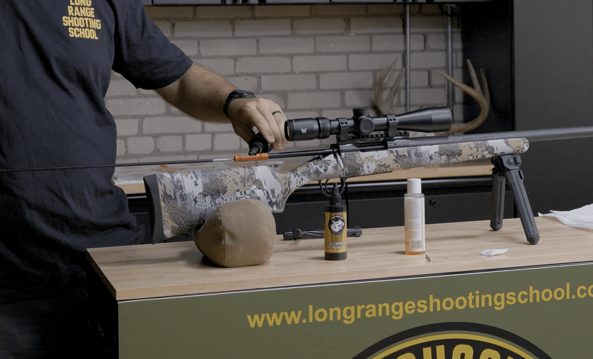 Close-up of someone cleaning a rifle, rifle care after hunting season concept.