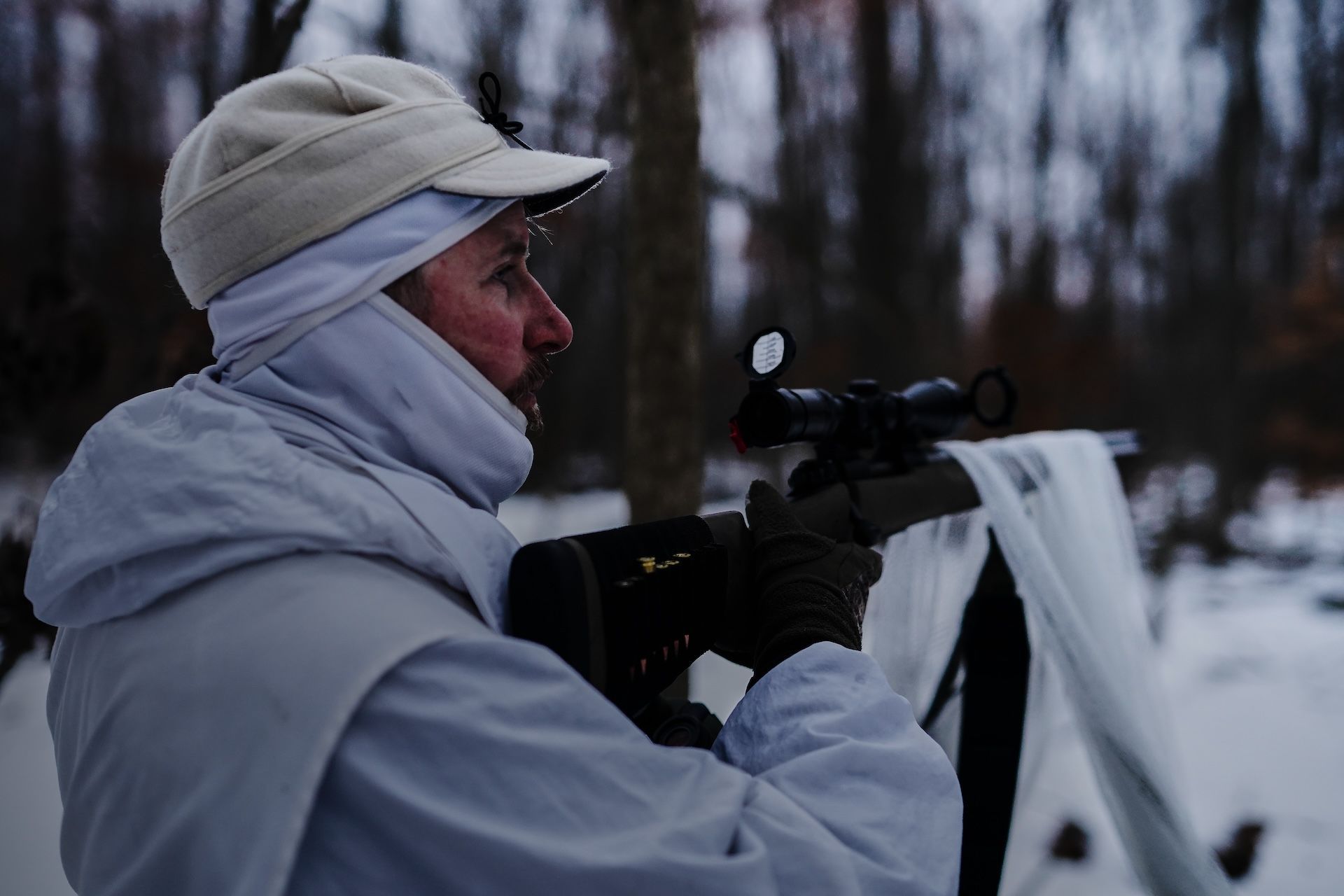 A hunter on a coyote hunt at night.