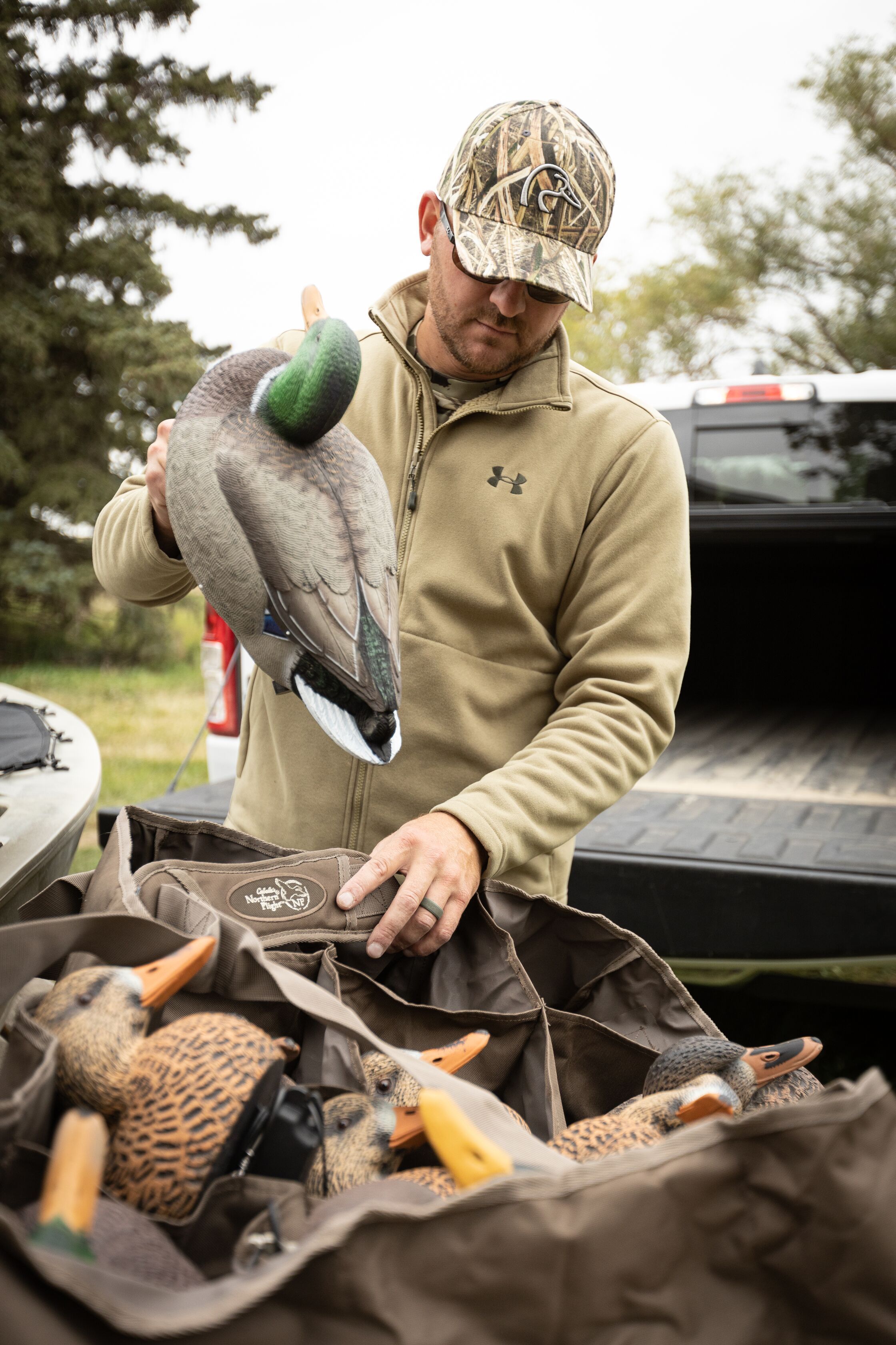Hunter with duck decoys in truck, Texas duck season concept.