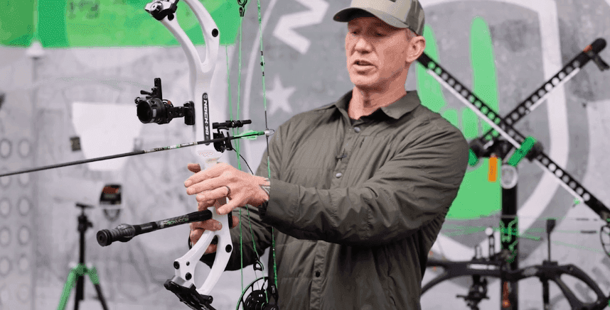 John Dudley showing how to grip compound bows.