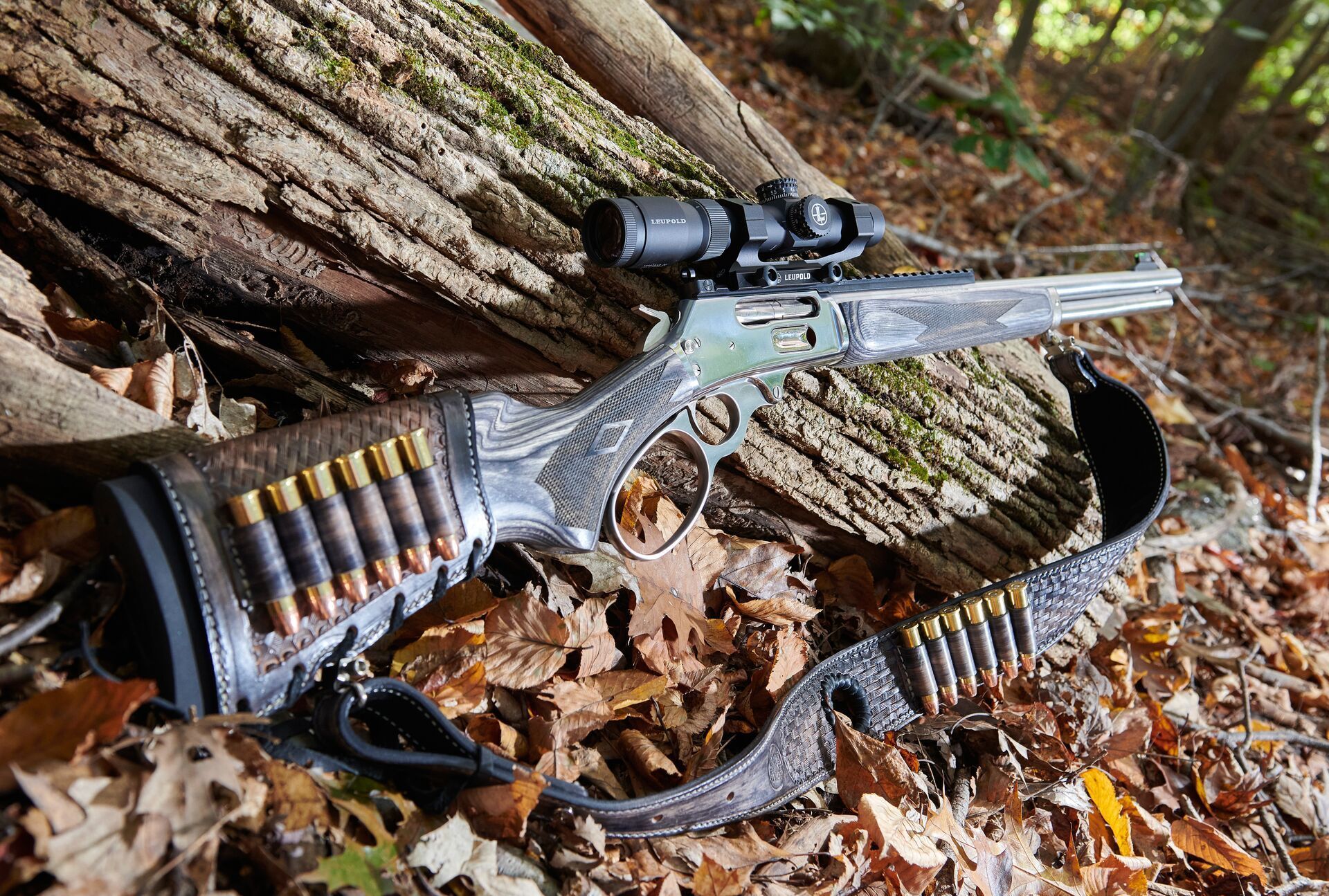 A lever action rifle with a scope sideview, choose gun calibers concept.