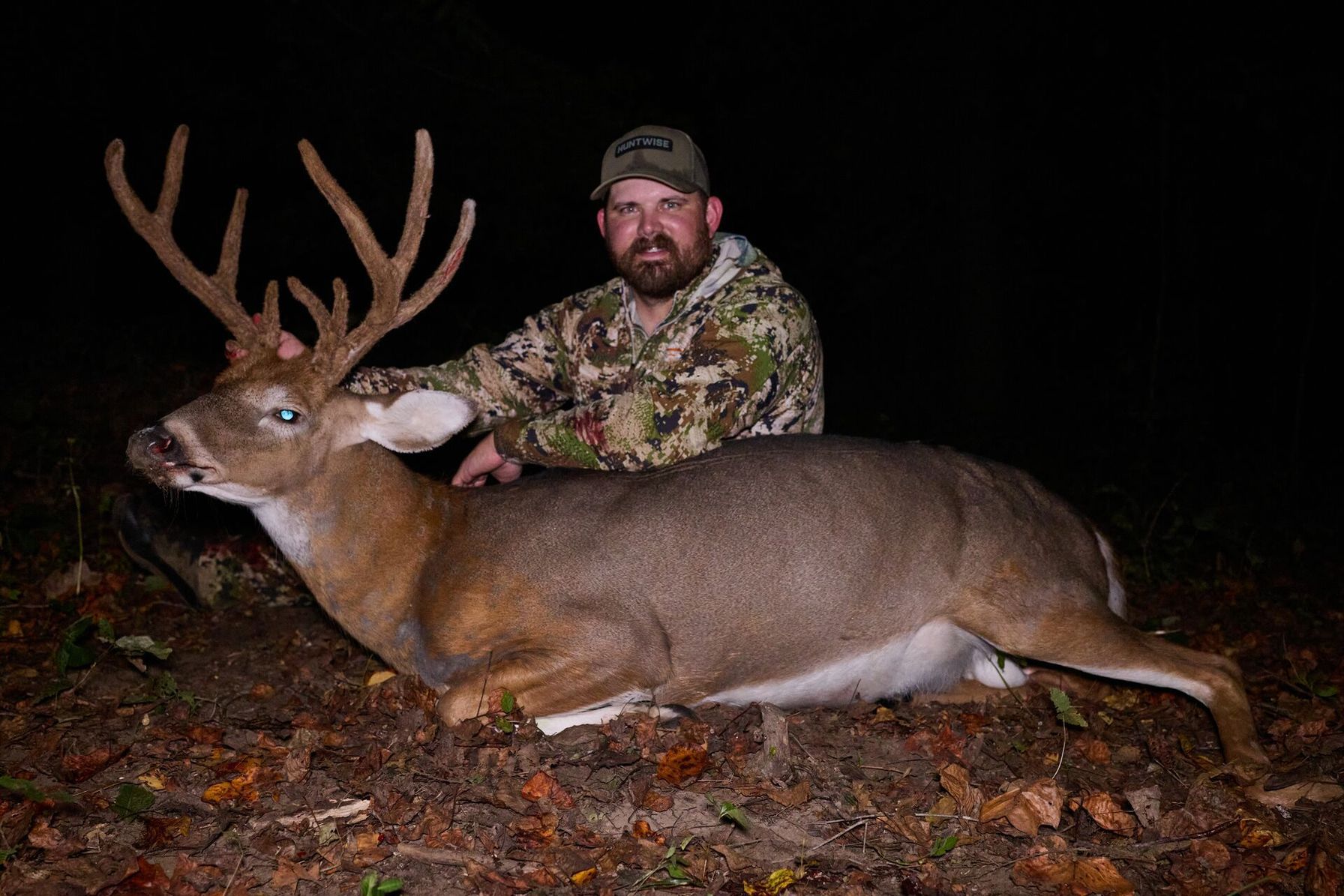 Hunter Quinn Badder with deer after hunt, how to plan a deer hunt with HuntWise concept.
