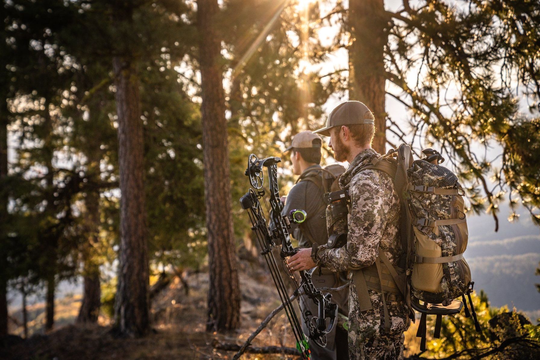 Hunters with a bow in the trees, North Carolina hunting concept.