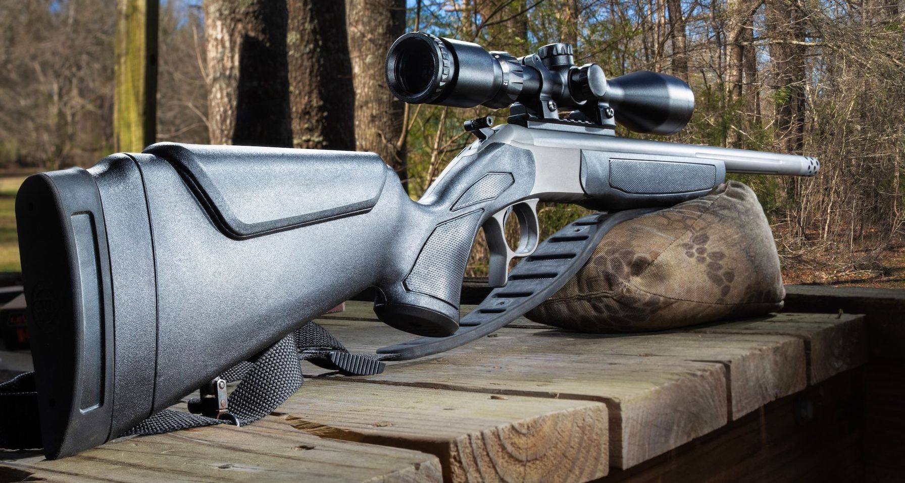 Muzzleloader on table propped on sandbag, muzzleloader hunting tips concept.