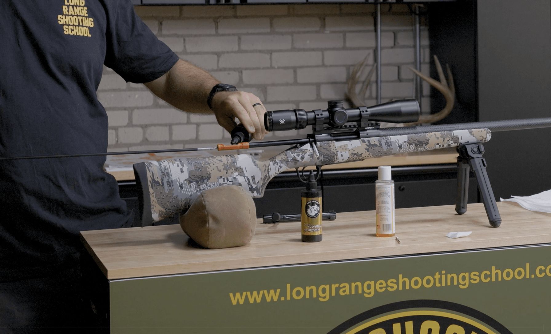 Close-up of someone cleaning a rifle, rifle care after hunting season concept.