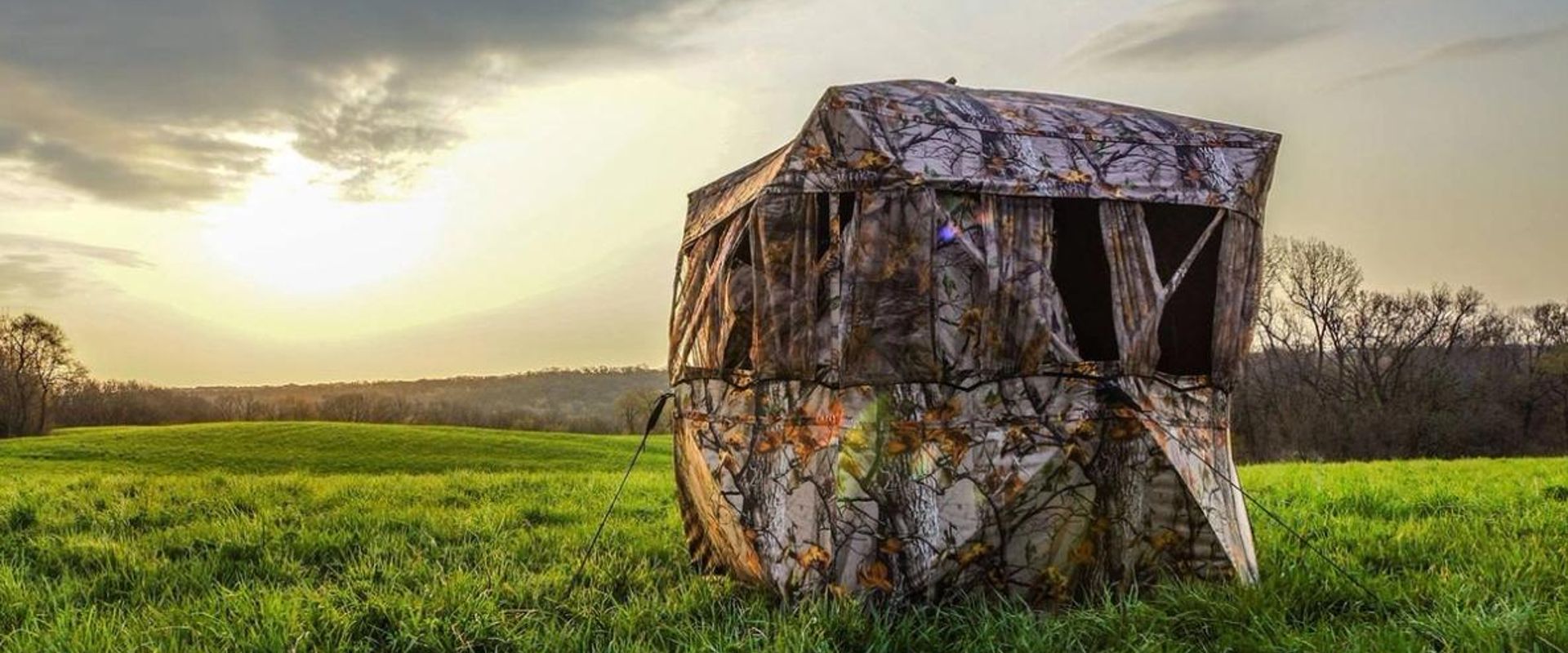 A ground blind in a field.