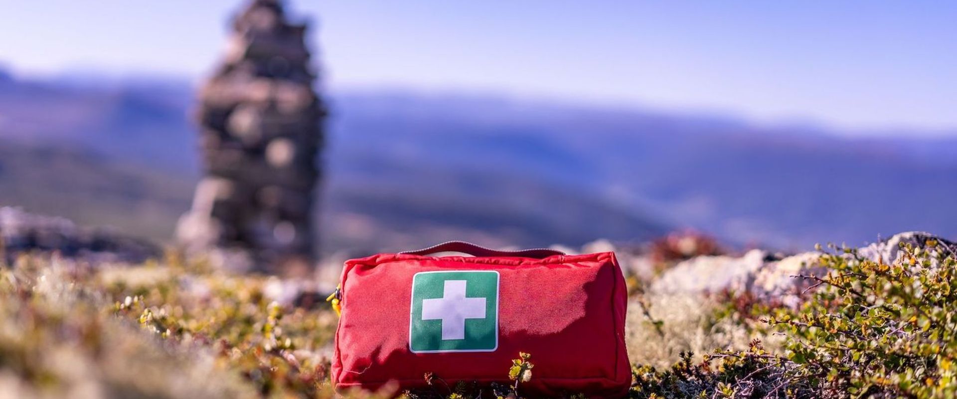 A first aid kit on the ground, hunting first aid kit concept.