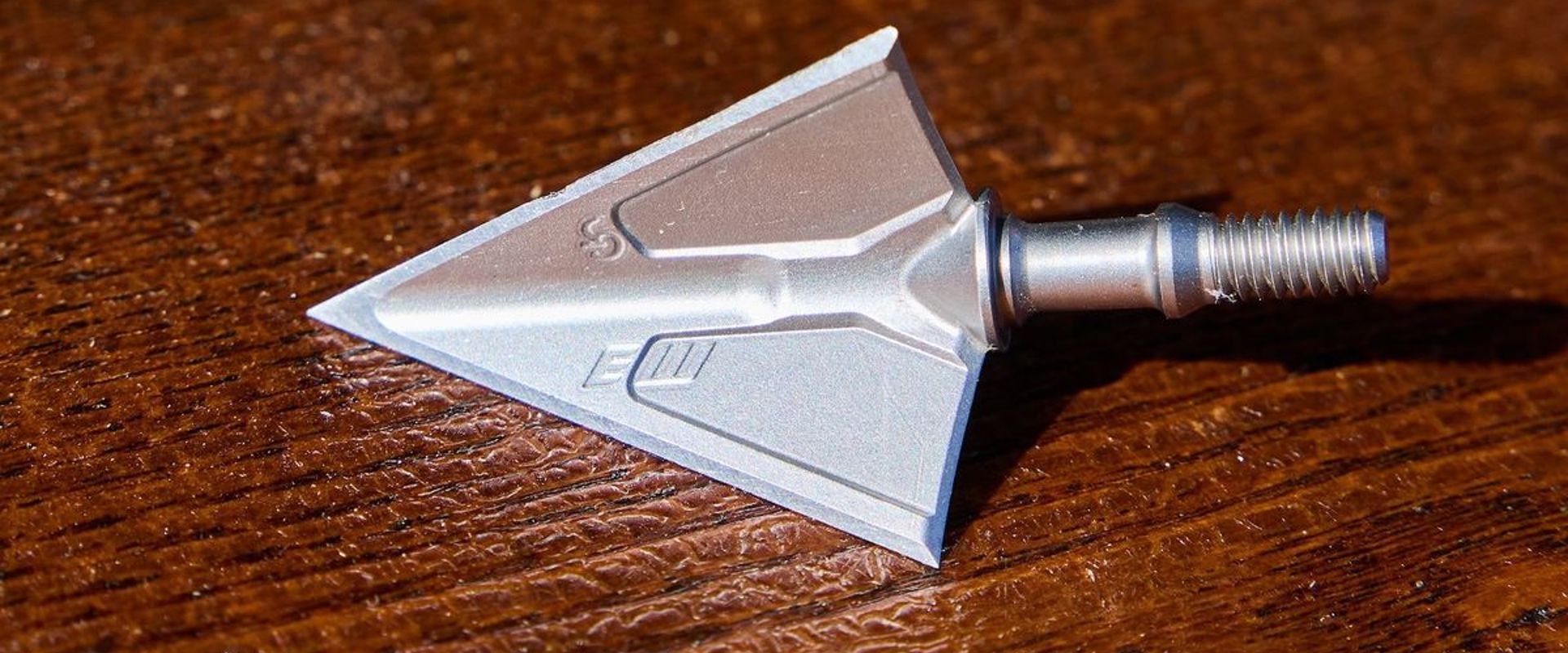 A broadhead on a table, how to test broadhead sharpness concept.