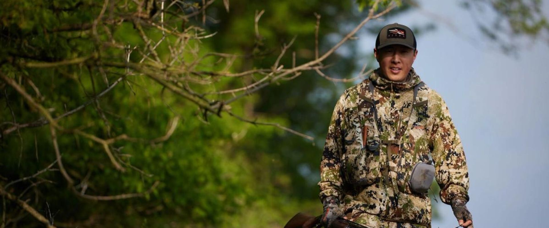A hunter in the woods, when is turkey season Minnesota concept.