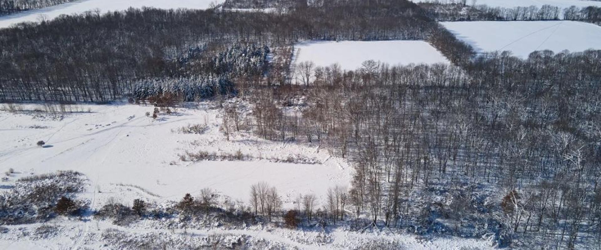 Overhead view of snowy land, how to find property lines in Alaska concept. 