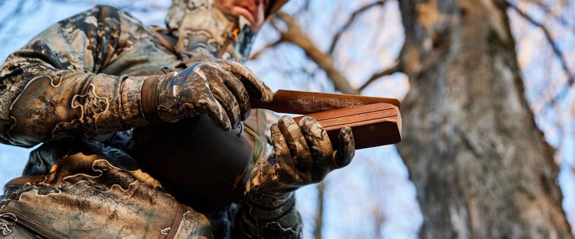 A hunter with a turkey call ready for Michigan turkey season.