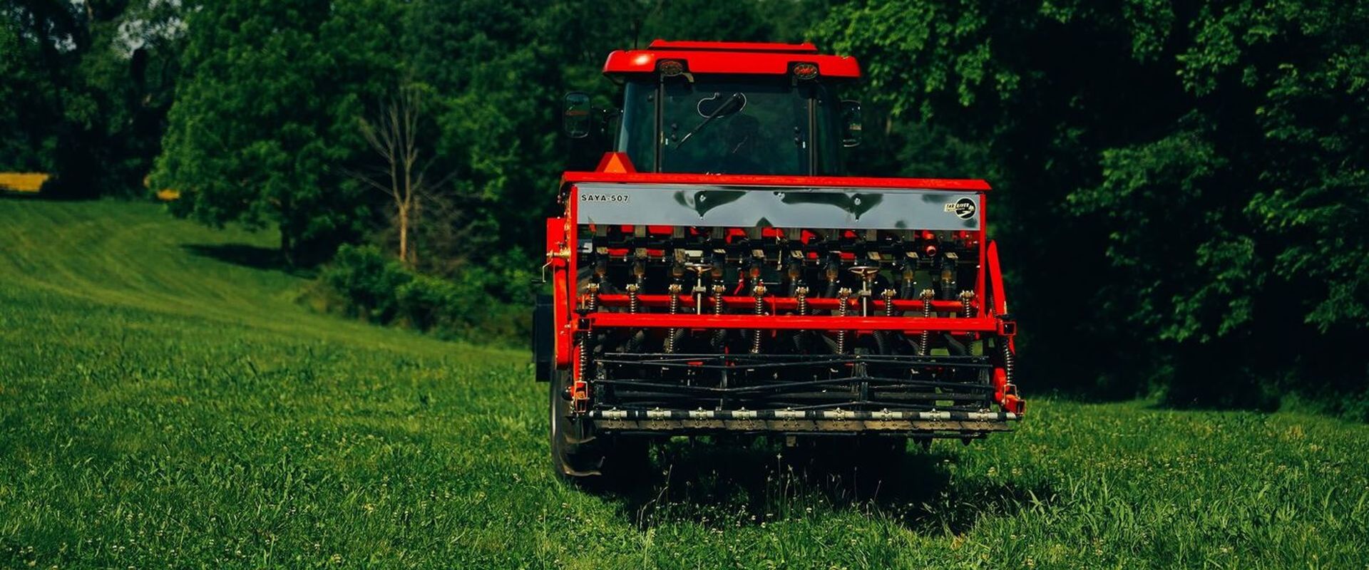 Tractor on a food plot for planting, food plot equipment concept.