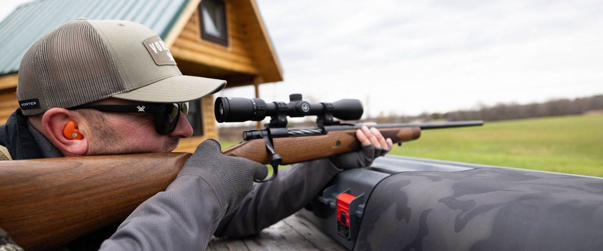 Hunter aims bolt action rifle, understanding bolt action rifle calibers concept.