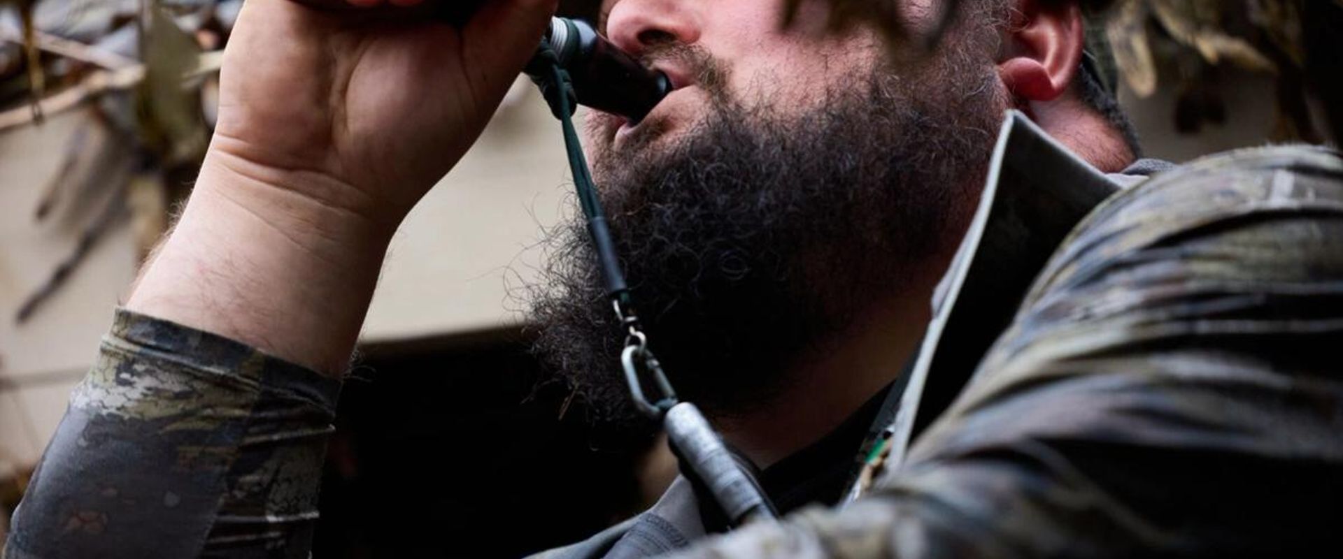 Hunter using a duck call, mastering the best duck calls concept.