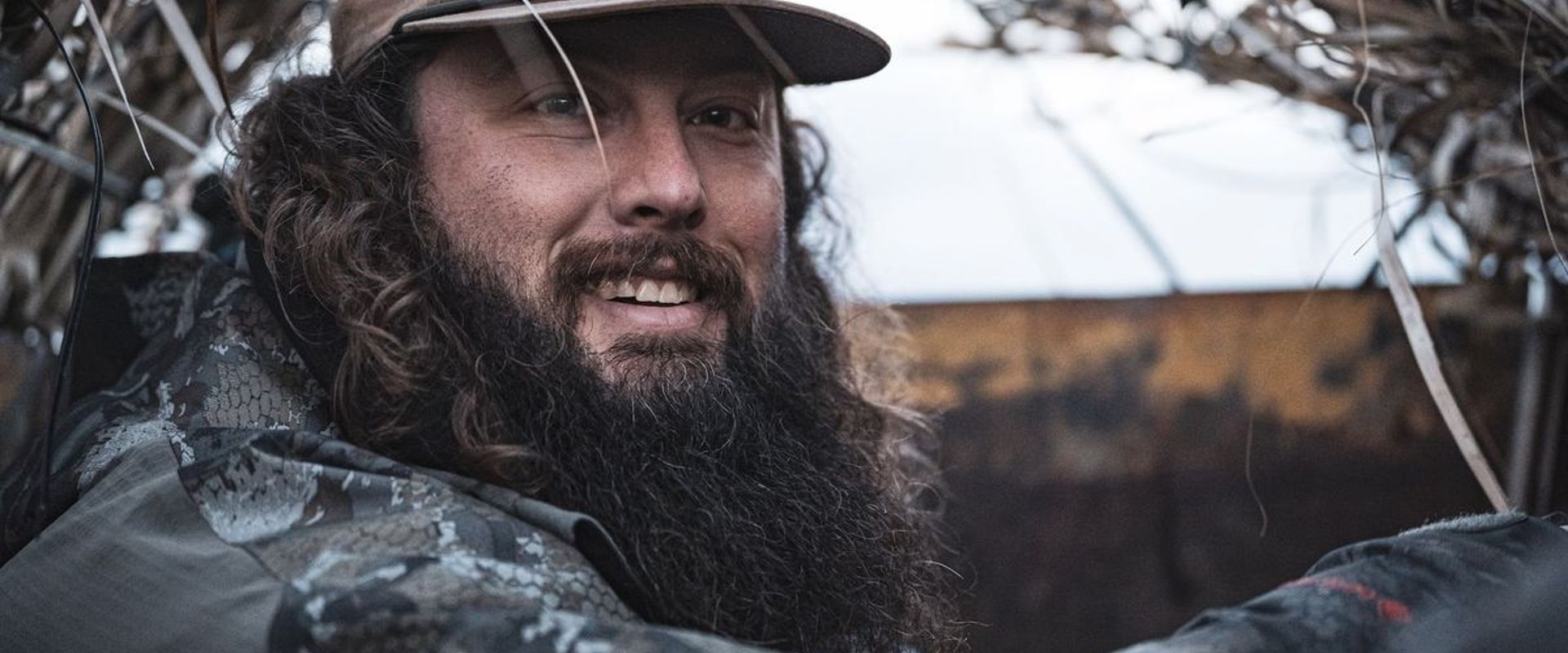 Close-up of Ben Cole in a duck blind, how to field dress a deer concept.