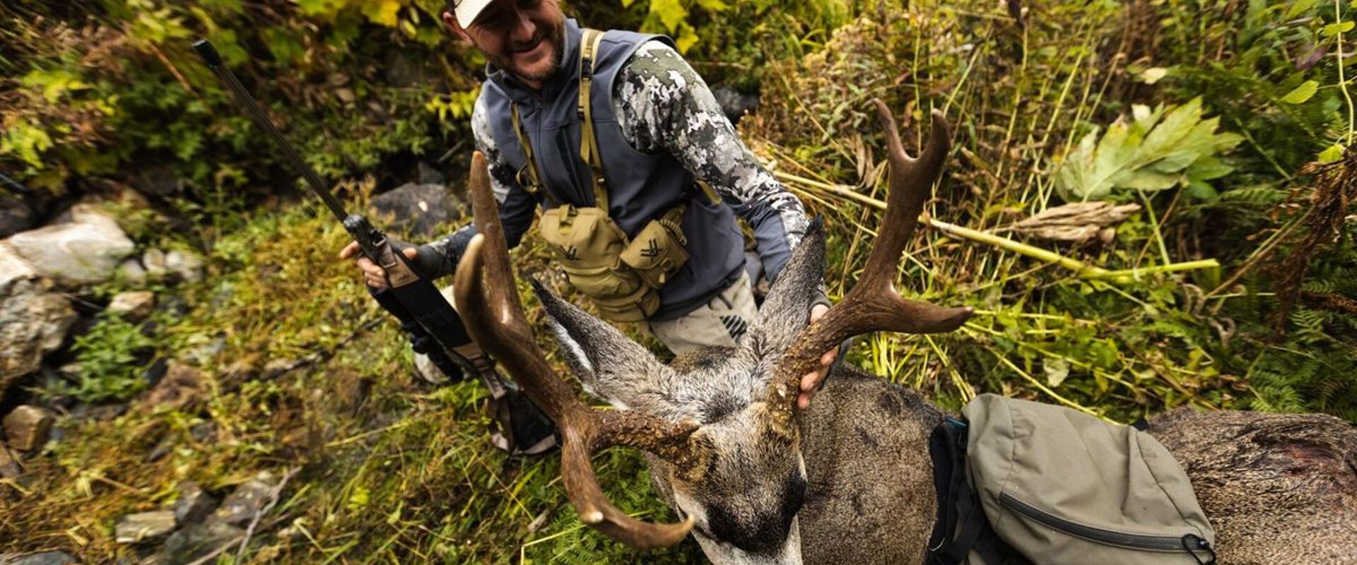 Overhead view of hunter with mule deer after hunt, when is California deer season 2026 concept.