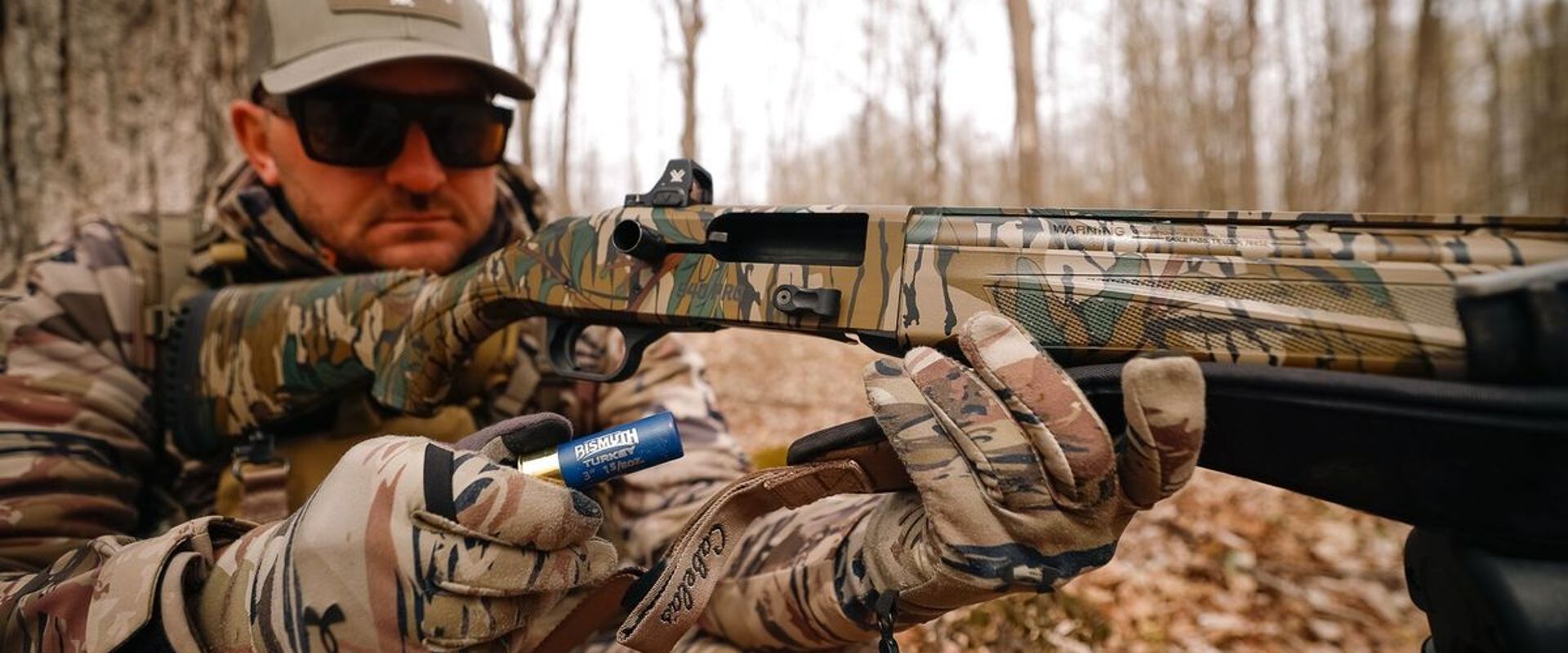 Hunter Taylor Wright loads a shell into a shotgun, how to pattern a shotgun for turkey concept.