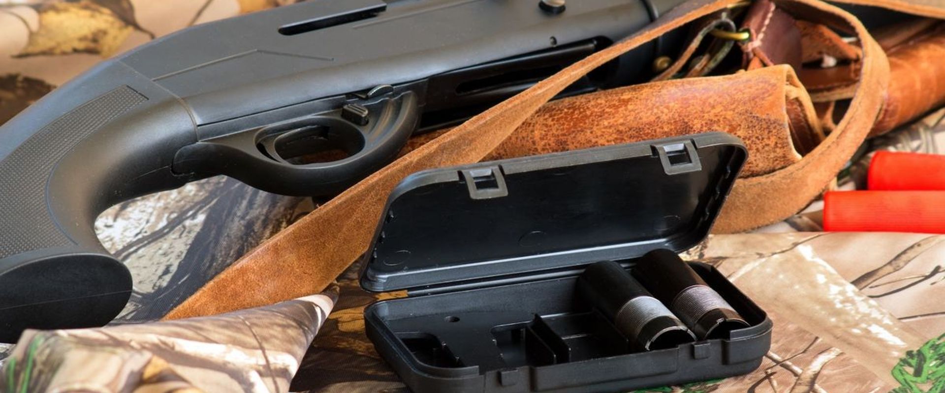 Chokes next to a shotgun, what's the best choke for dove hunting concept.