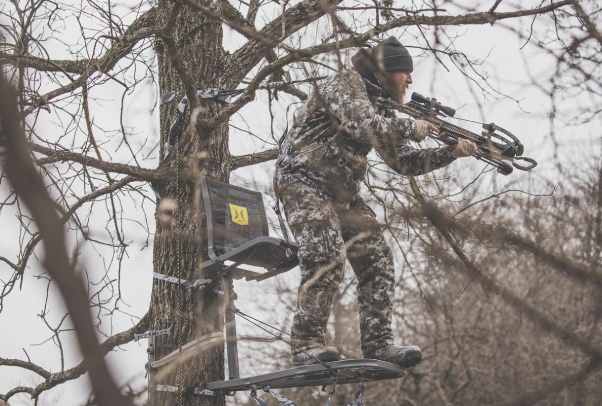 A hunter in a hang-on tree stand.