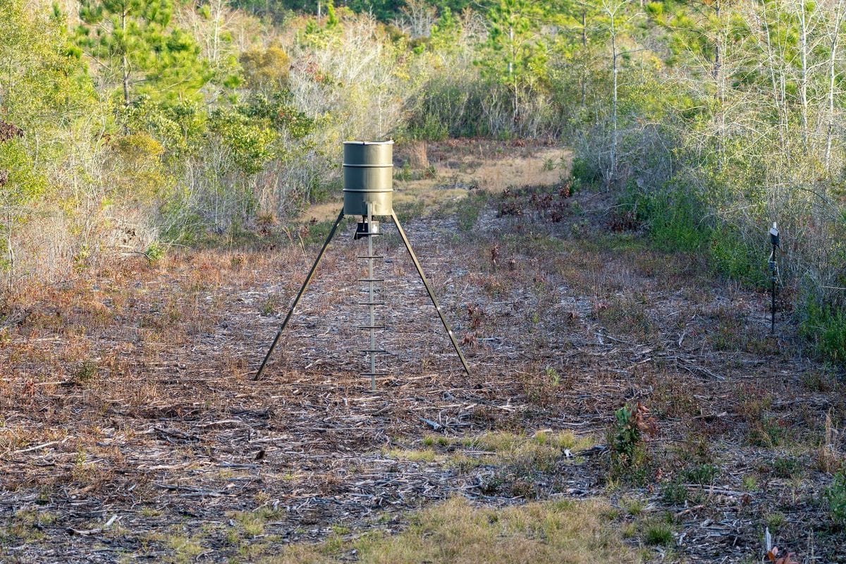 A deer feeder in a field.