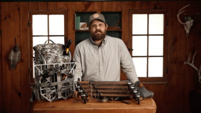 A HuntWise team member shows off mid-season hunting gear.