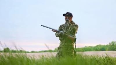 A hunter in turkey clothing, what to wear turkey hunting in the spring concept.