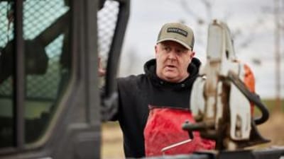 Jeff Sturgis standing near a tractor talking to someone off screen, how do moon phases affect deer movement concept.