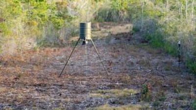 A deer feeder in a field.