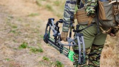 Hunter carrying hunting gear for deer hunts.