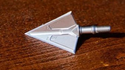 A broadhead on a table, how to test broadhead sharpness concept.
