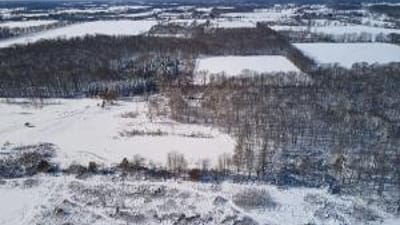 Overhead view of snowy land, how to find property lines in Alaska concept. 