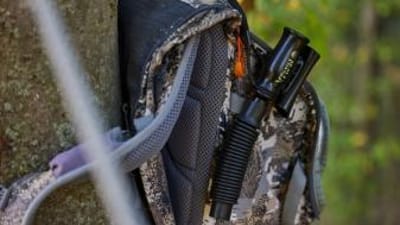A deer grunt call on a hunter's pack, use the best deer grunt call tips concept.
