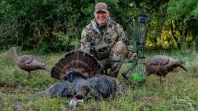 John Dudley with a turkey and decoys after turkey hunting.