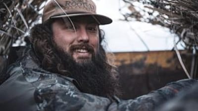 Close-up of Ben Cole in a duck blind, how to field dress a deer concept.