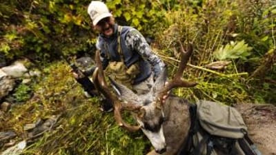 Overhead view of hunter with mule deer after hunt, when is California deer season 2026 concept.