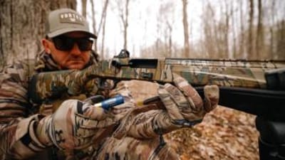 Hunter Taylor Wright loads a shell into a shotgun, how to pattern a shotgun for turkey concept.