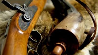 Close up of a muzzleloader and accessories.