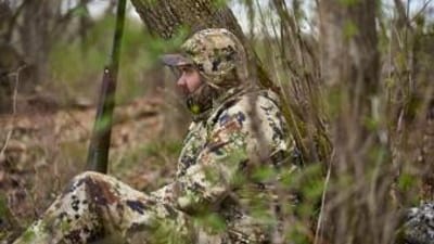 A hunter waits for a spring tom, turkey hunting concept.