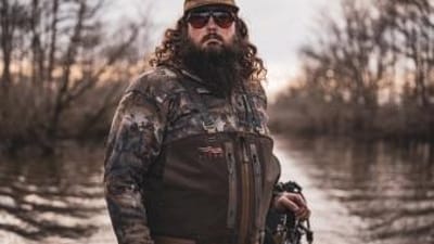 Ben Cole of RootedTV in duck hunting gear, waterfowl hunting tips concept.