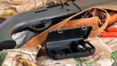 Chokes next to a shotgun, what's the best choke for dove hunting concept.