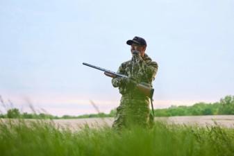A hunter in turkey clothing, what to wear turkey hunting in the spring concept.