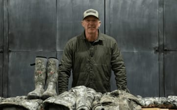 John Dudley in front of his late season hunting clothes recommendations.