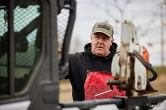 Jeff Sturgis standing near a tractor talking to someone off screen, how do moon phases affect deer movement concept.