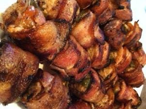 Close-up of bacon wrapped turkey rolls, wild game appetizers concept.